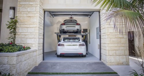 Autostacker car lift in a garage with two cars parked one on top of the other