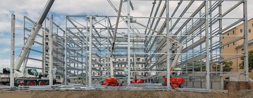 Construction of a parking garage, steel frame structure with cranes